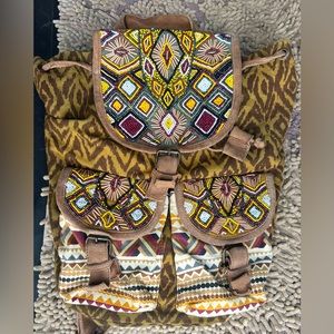 Boho Backpack with Intricate Beading and Tribal Patterns